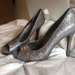 Nine West metallic silver peek toe pumps
